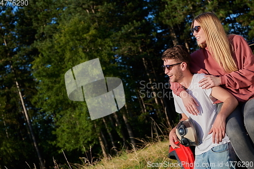 Image of couple enjoying beautiful sunny day while driving a off road buggy