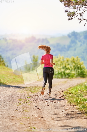 Image of woman enjoying in a healthy lifestyle while jogging