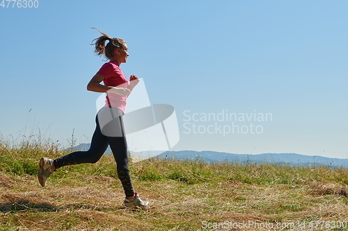 Image of woman enjoying in a healthy lifestyle while jogging