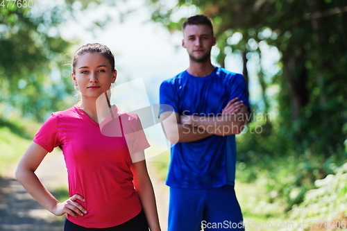 Image of young couple preparing for a morning run