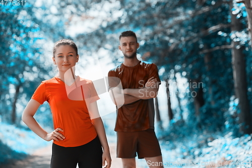 Image of young couple preparing for a morning run