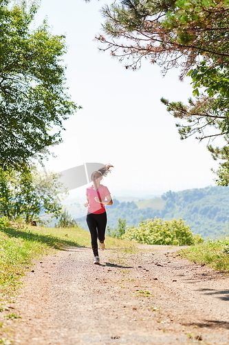 Image of woman enjoying in a healthy lifestyle while jogging