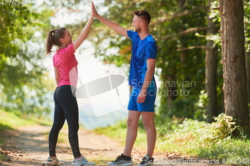 Image of young couple preparing for a morning run