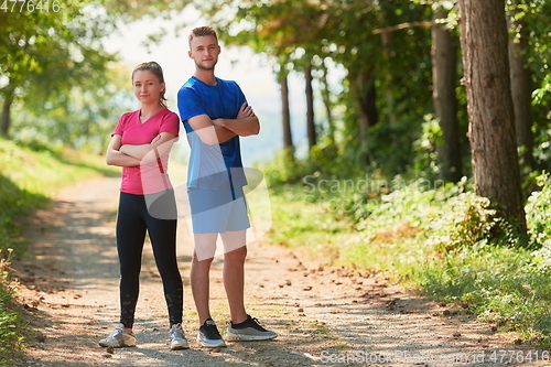 Image of young couple preparing for a morning run