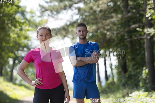 Image of young couple preparing for a morning run