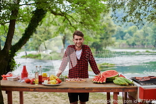 Image of man cooking tasty food for french dinner party