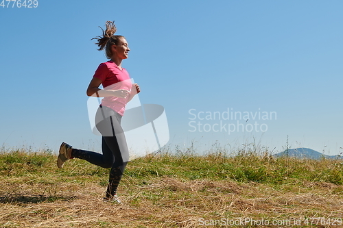 Image of woman enjoying in a healthy lifestyle while jogging