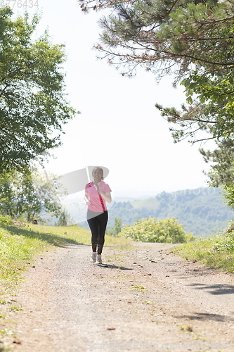 Image of woman enjoying in a healthy lifestyle while jogging