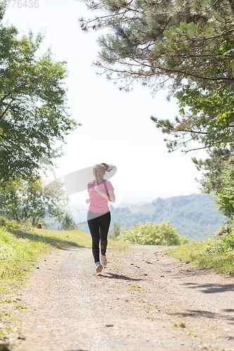 Image of woman enjoying in a healthy lifestyle while jogging