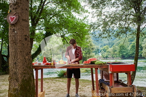 Image of man cooking tasty food for french dinner party