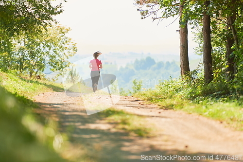 Image of woman enjoying in a healthy lifestyle while jogging