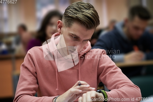 Image of the student uses a smartwatch in math class