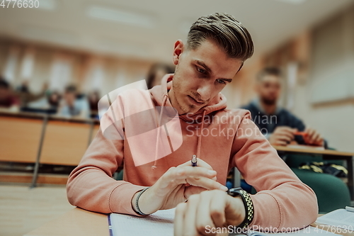 Image of the student uses a smartwatch in math class