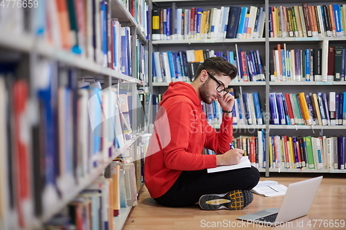 Image of the students uses a notebook, laptop and a school library