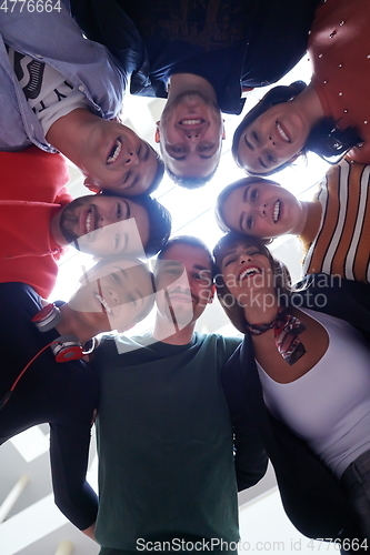 Image of group of happy young people showing their unity