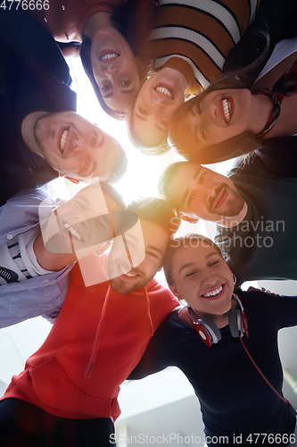 Image of group of happy young people showing their unity