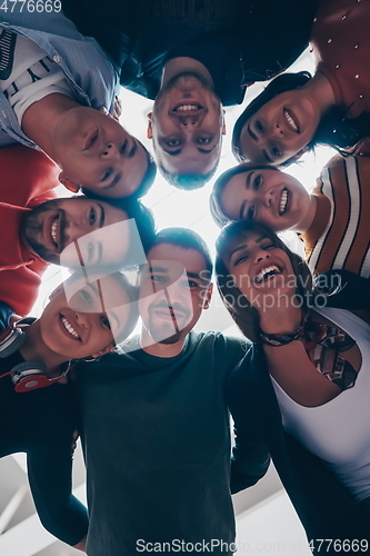 Image of group of happy young people showing their unity