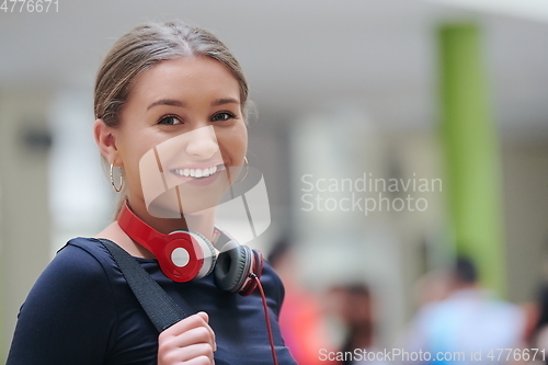 Image of famel student with modern technology in school