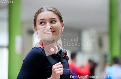 Image of famel student with modern technology in school