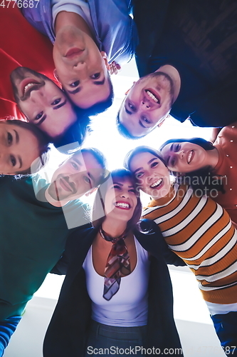 Image of group of happy young people showing their unity