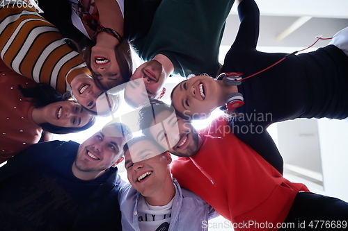 Image of group of happy young people showing their unity