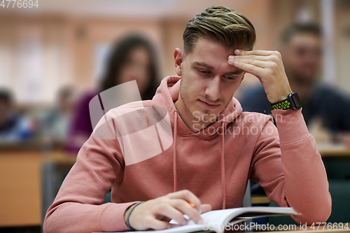 Image of the student has a headache in class