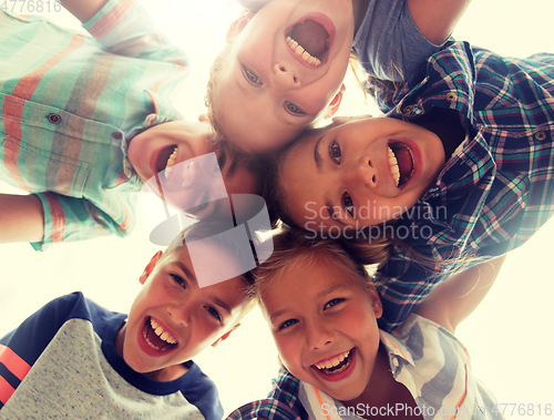 Image of group of happy children faces in circle