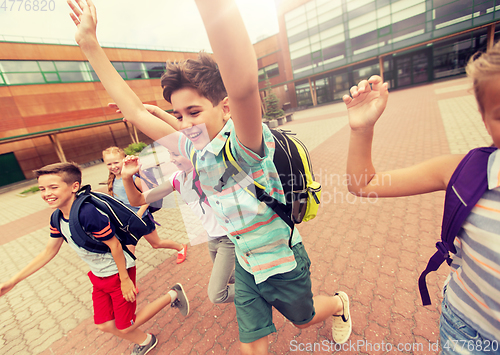 Image of group of happy elementary school students running