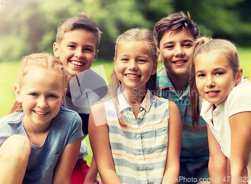 Image of group of happy kids or friends outdoors