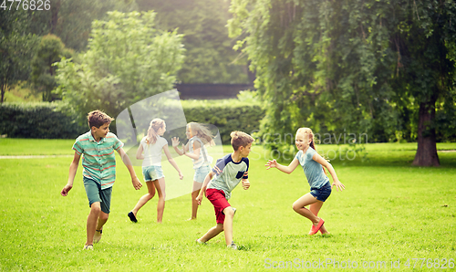 Image of happy kids running and playing game outdoors