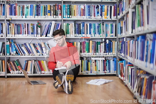 Image of the students uses a notebook, laptop and a school library