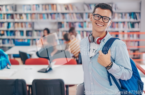 Image of the student uses a notebook, latop and a school library