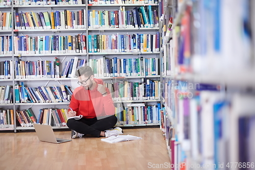 Image of the students uses a notebook, laptop and a school library