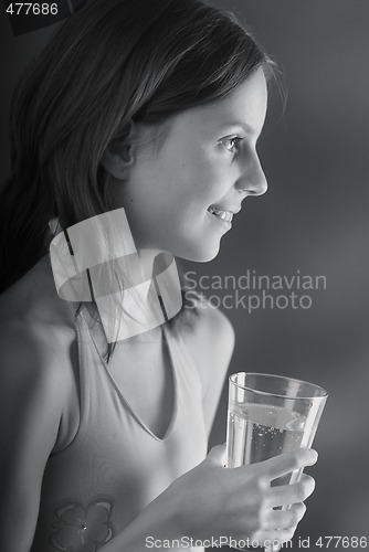 Image of A girl with a glass of water