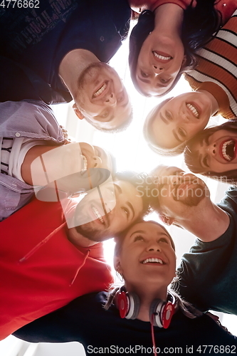 Image of group of happy young people showing their unity