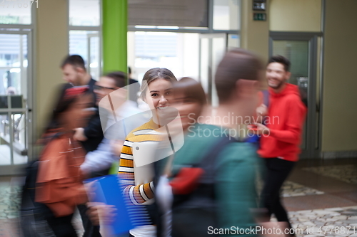 Image of famel student with modern technology in school