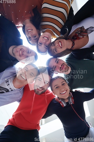 Image of group of happy young people showing their unity