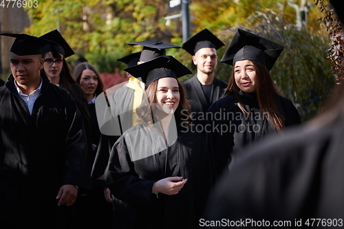 Image of Group of diverse international graduating students celebrating