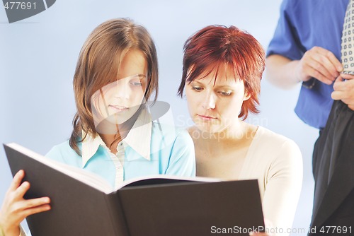 Image of A family with a book