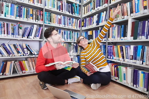 Image of the students uses a notebook, laptop and a school library