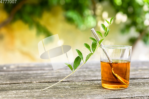 Image of verbena tea on old wooden planks