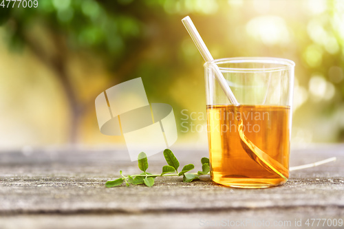 Image of verbena tea on old wooden planks