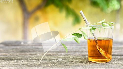 Image of verbena tea on old wooden planks