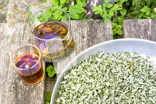 Image of verbena tea on old wooden planks