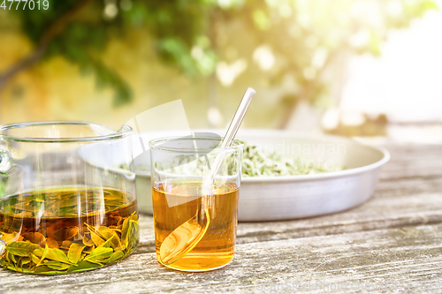 Image of verbena tea on old wooden planks