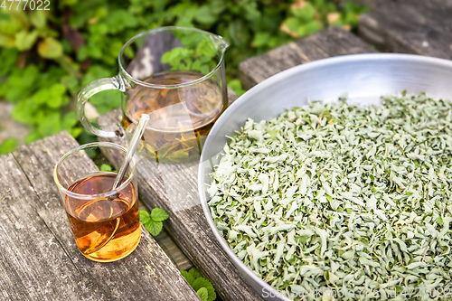 Image of verbena tea on old wooden planks