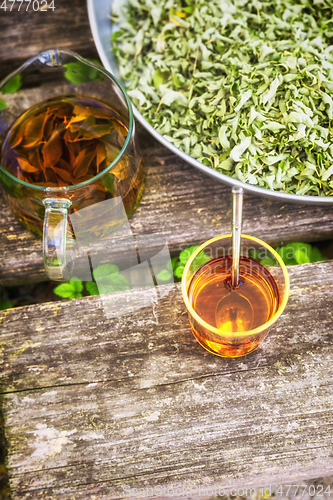 Image of verbena tea on old wooden planks