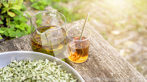 Image of verbena tea on old wooden planks