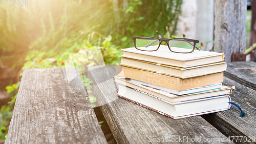 Image of books and reading glasses