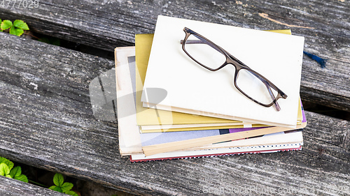 Image of books and reading glasses